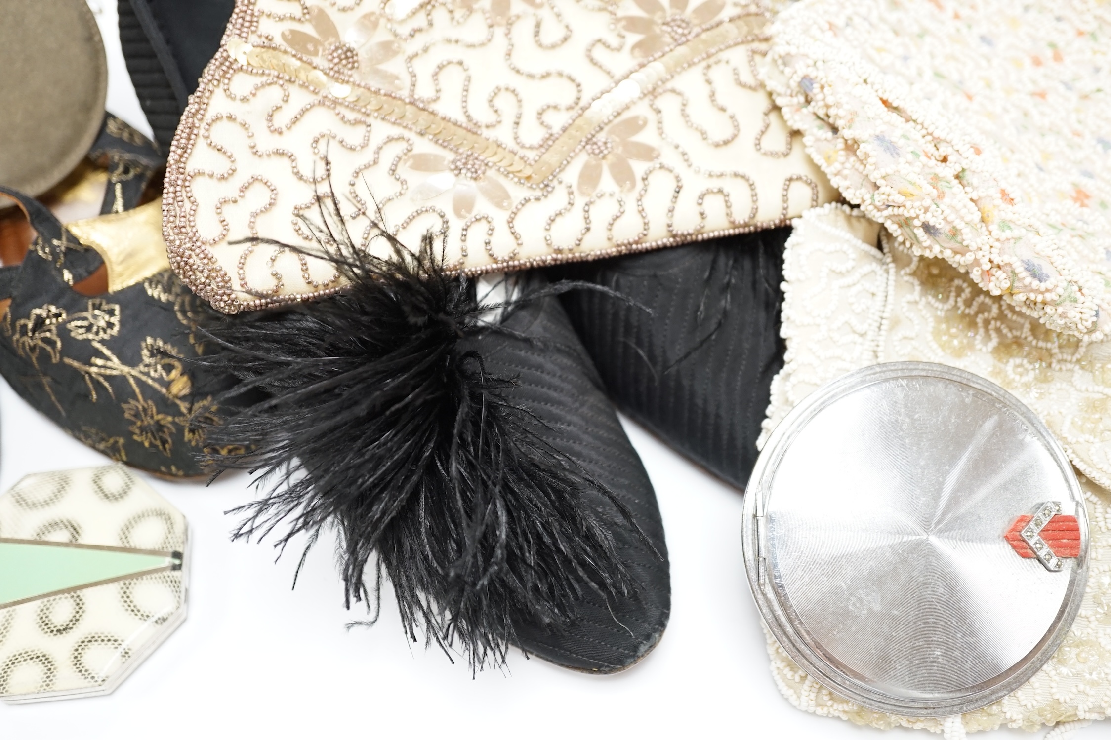 A pair of ladies black feather decorated 1940’s evening shoes, a similar gold leather and brocade pair of shoes, with a collection of bead bags, compacts, etc.
